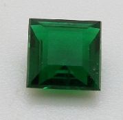 An apple green square cut emerald of approximately 0.