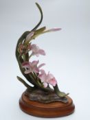 Royal Worcester Ornamental Studio Orchid with butterfly by David Fryer, with plinth,