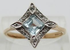 A 9ct gold ring set with a square cut aquamarine surrounded by diamonds,