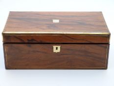 A 19thC walnut writing slope with two secret drawers,