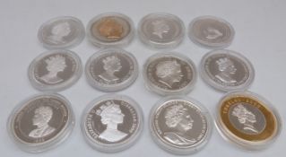 Silver Royal Commemorative crown sized coins in capsules,