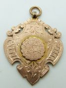 An Edwardian 9ct rose gold fob for Haslingden Wheelers 1904, 11.