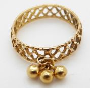 A yellow metal ring with bauble decoration, size O, 2.