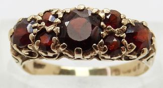 A 9ct gold ring set with garnets,