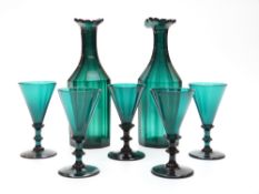 A blue glass drinking set comprising two cut glass decanters, 14.