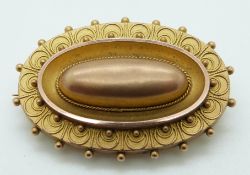Victorian 9ct gold brooch with applied wire decoration and glass compartment verso, 7.8g, 4cm x 2.