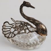 A hallmarked silver mounted cut glass novelty salt formed as a swan with articulated wings,