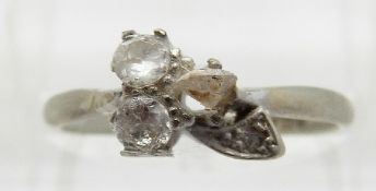 An 18ct white gold ring set with three diamonds in a clover shape,