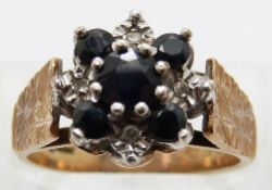 A 9ct gold ring set with sapphires and diamonds,