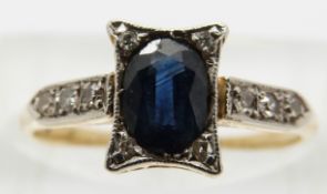 Art Deco 18ct gold ring set with an oval sapphire and diamonds in a platinum setting,