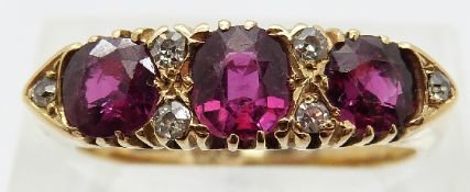 An 18ct gold ring set with three rubies and six diamonds,