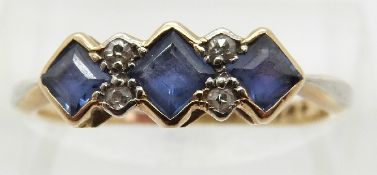 An 18ct gold ring set with square cut sapphires and old cut diamonds,