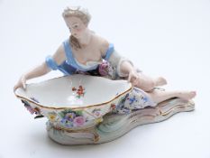 Meissen figural salt with applied flower decoration,