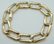 A 9ct gold bracelet made up of elongated links,