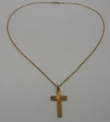 A 9ct gold chain and a 9ct gold cross pendant, 3.