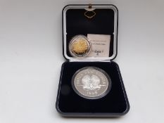 Papua New Guinea 1998 5oz silver coin and a Queen's Diamond Jubilee plated coin