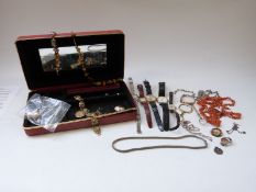 A collection of jewellery including a coral necklace, silver St Christopher, silver necklace,