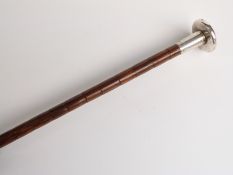 Edwardian parasol with hallmarked silver handle of flattened circular and engine turned form,