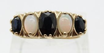 A 9ct gold ring set with alternating sapphires and opals,