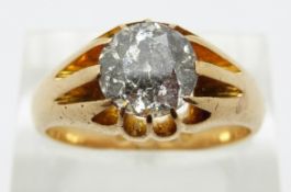 An 18ct gold ring set with a round cut diamond of approximately 1.