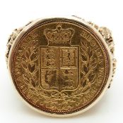 A 9ct gold ring set with a gold full sovereign, shield back, size Z/1, 20.