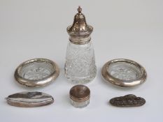 Hallmarked silver and cut glass sugar sifter, two white metal-mounted coasters marked sterling,