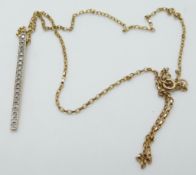 A 9ct gold pendant set with diamonds on a 9ct gold chain