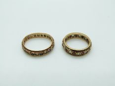Two 9ct gold eternity rings set with paste