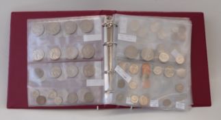 An amateur collection of overseas coins in an album to include Australia, New Zealand, Canada,