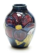 Moorcroft vase in Clematis pattern on a blue ground,