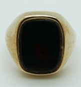A 9ct gold ring set with a bloodstone, size V, 12.