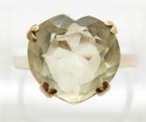 A 9ct gold ring set with a heart cut citrine,