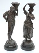 Pair of 19thC or early 20thC French spelter figures, lady and gentlemen with baskets of grapes,