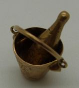 A 9ct gold Champagne bucket charm, 2.