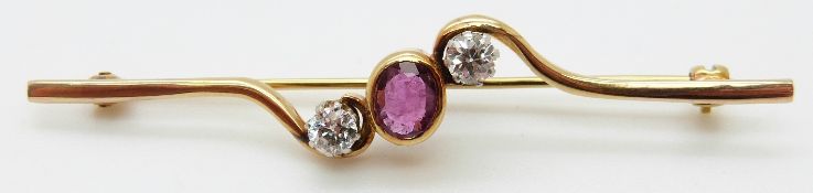 An 18ct gold brooch set with an oval ruby of approximately 0.