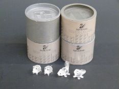 Four Swarovski Crystal cut glass figure groups Pigs and Beavers,