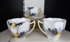 Eleven pieces of Shelley teaware in Sunrise and Tall Trees pattern no 11678