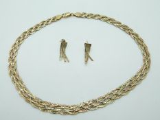 A 14ct gold bicoloured plaited necklace with matching earrings, 21.