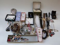 A collection of jewellery including earrings,
