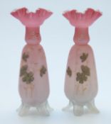 A pair of Victorian glass vases with hand decoration and crimped rims,