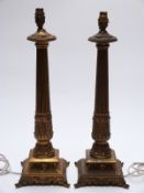 A pair of gilt table lamps,