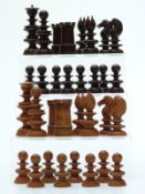 A 19thC English Calvert wooden chess set with turned and carved pieces,