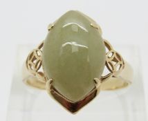 A 14ct gold ring set with agate cabochon with pierced shoulders, size R, 4.