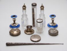 A pair of hallmarked silver and blue guilloché enamel candlesticks,