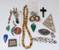 An agate cross pendant, carved carnelian agate disc, silver plated continental brooch,