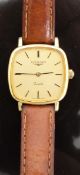 Longines gold plated ladies wristwatch with gold face, black hands, two tone baton hour markers,
