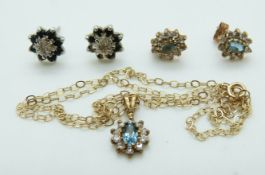 A pair of 9ct white gold earrings set with a diamond and sapphires,