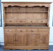 Pine dresser with plate rack and drawers to top and four drawers and four cupboards to base W183 x