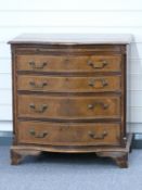 A serpentine fronted chest of four graduated drawers with brush slide W68 x D45 x H75cm