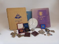 A collection of medal/commemorative coins to include cased Prince Albert colonial exhibition 1886,